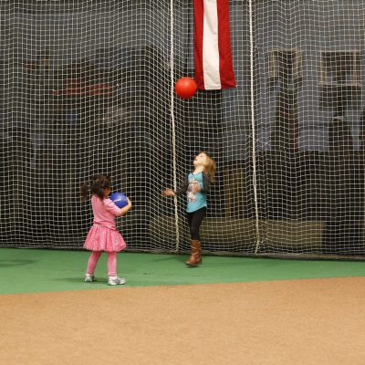 Kids playing with red and blue ball