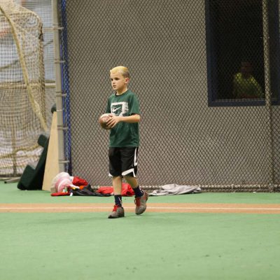 Kid punting football