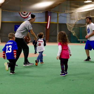 Young children playing baseball